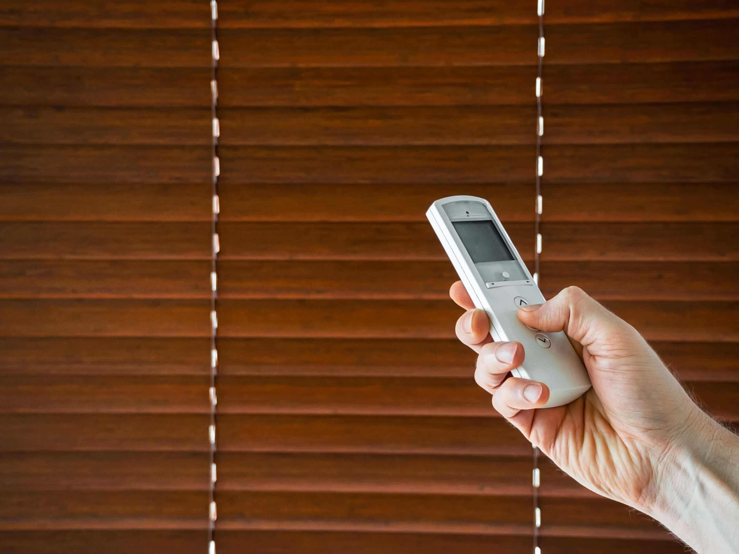 Motorized Arch Window Blinds. Using remote to control blinds.